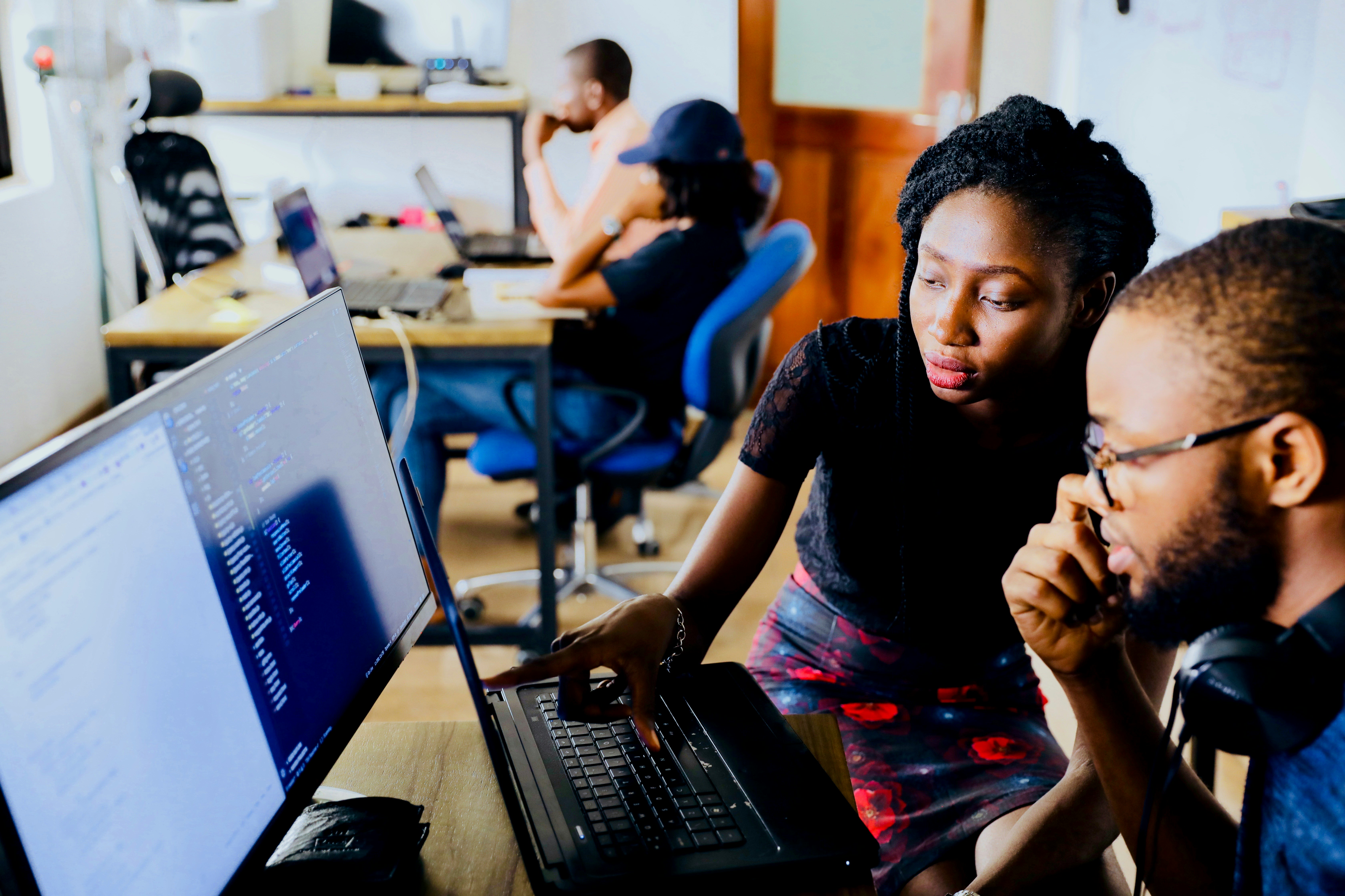 Photo by Desola Lanre-Ologun on Unsplash of two employees at a startup incubator